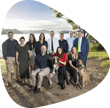 Group photo of the members in front of a scenic background