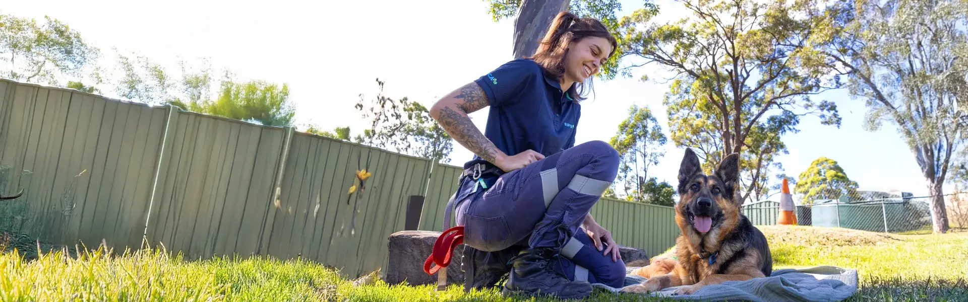 RSPCA representative sitting with a dog
